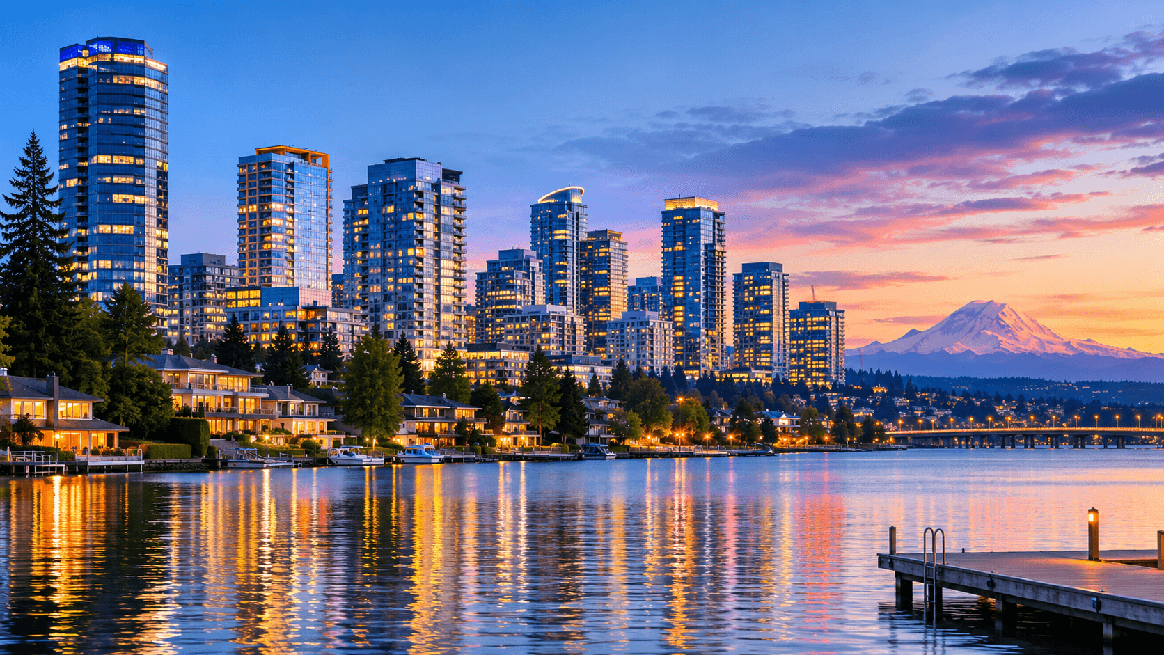 Bellevue skyline at dusk with Lake Washington in the foreground and Mount Rainier visible in the distance