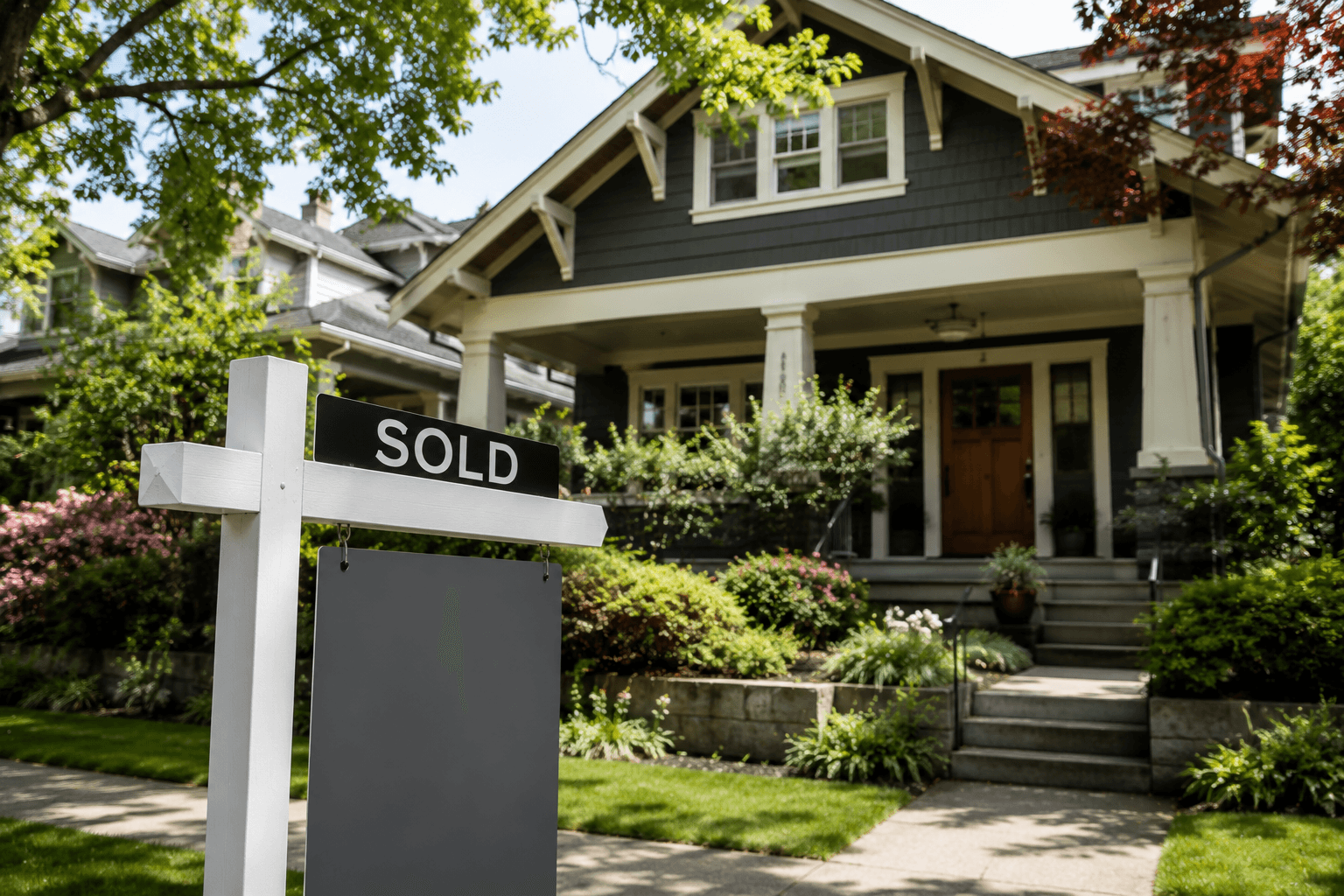 Seattle home with sold sign and confident presentation in a residential street